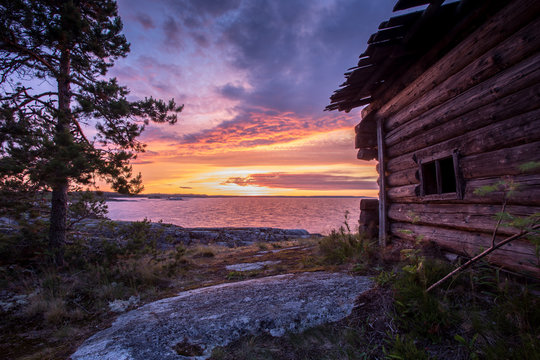 Wooden house at dawn, Ladoga lake, Karelia, Russia