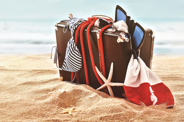 Broken suitcase washed up on ocean beach