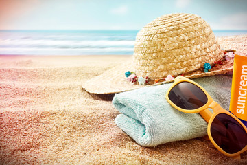 Sunglasses and sunbathing items with vignette