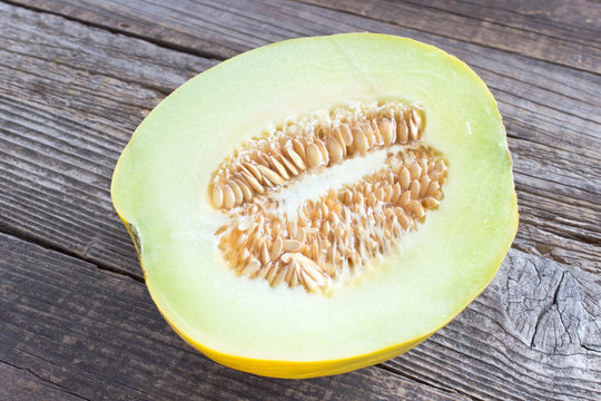 Cantaloupe melon on wooden background