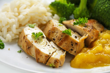 chicken breast fillet with fruity mango chuntey, broccoli and rice, closeup