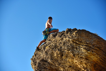 Extreme Climber Climbs On A Rock