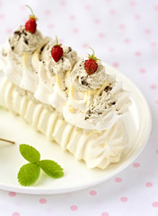 meringue cake with fresh berries on white background