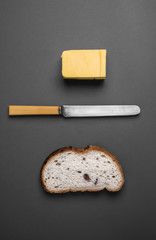 Bread and butter - knife, butter and bread viewed from above