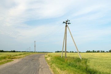 Fototapeta na wymiar Poles with electric wires.
