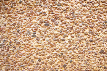 Wall of small sand stone,gravel wall texture background