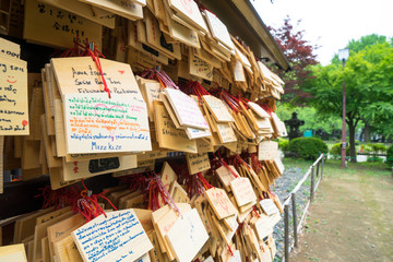 wood plates with good wish hanging in temple in tokyo