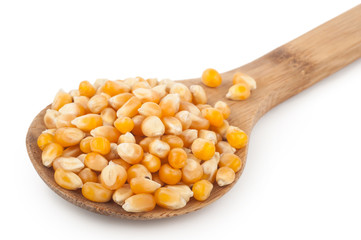 Corn seeds with wooden spoon
