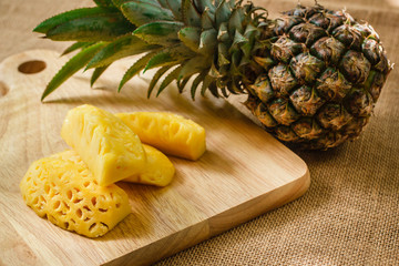 Pineapple on cutting boards wood.
