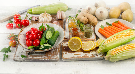 Raw organic vegetables with fresh herbs and spices.