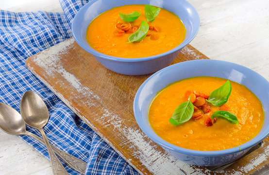 Two bowls of Carrot soup.