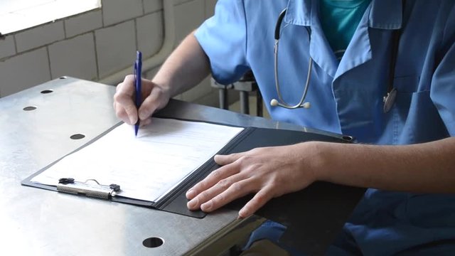 doctor signs the document