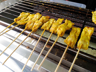 grilled pork satay on stove