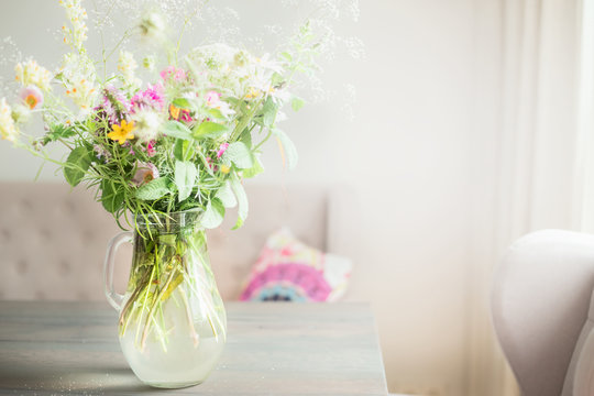 Lovely Wild Flowers Bunch In Glass Vase On Table In Light Living Room , Home   Decoration And Interior.