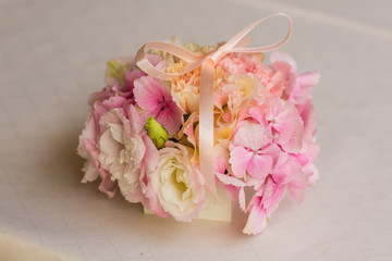 Wedding ring pillow made of beautiful pink flowers 