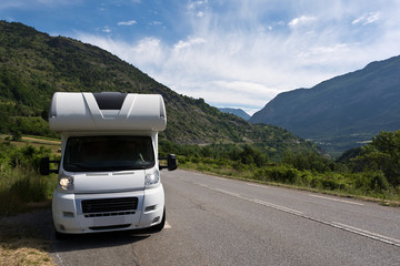 camper on the road in the French Alps 