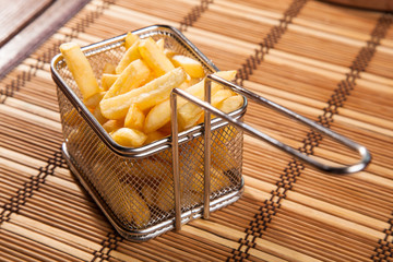 French fries in an iron basket