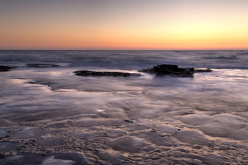 Silky water on the rocks after sunset, Nahariya, HDR