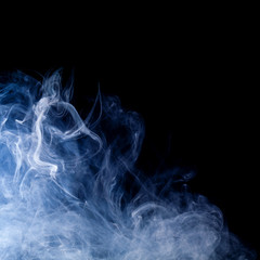 blue smoke swirls over black background