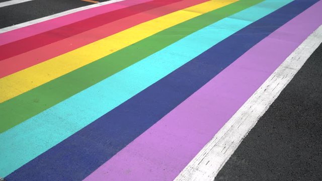 Pride Crosswalk Vehicle and Foot Traffic, Vancouver 4K, UHD. Pedestrians and vehicles at the rainbow colored crosswalk in downtown Vancouver. Canada.
