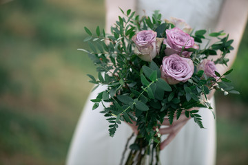 Bride holding wedding bouquet 