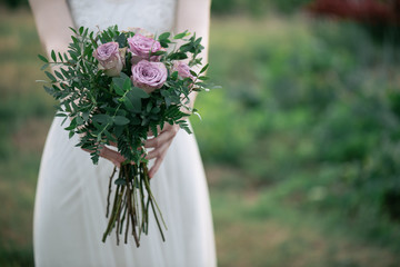 Bride holding wedding bouquet 