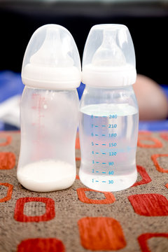 baby bottle of powdered milk and water at home