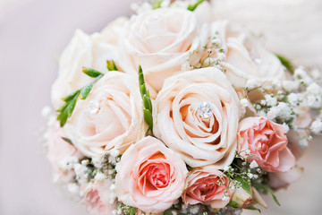 Wedding bouquet. Bride's traditional symbolic accessory. Floral composition with pink rose flowers.