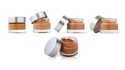 Open cosmetic cream bottles
