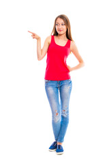 Young attractive woman in blue jeans isolated on white background. Beautiful girl model posing in the studio.