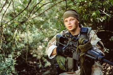 Army sniper during the military operation in the mountain. war,