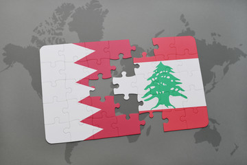 puzzle with the national flag of bahrain and lebanon on a world map background.