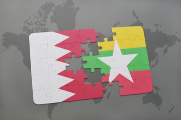 puzzle with the national flag of bahrain and myanmar on a world map background.