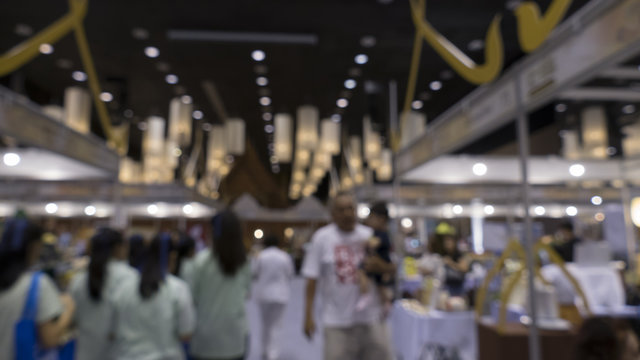 people shopping in exhibiton trade fair - blur