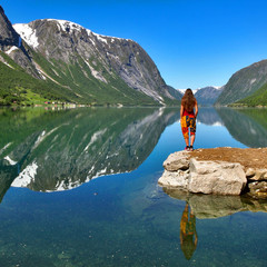 The woman enjoying the lake view in Norway