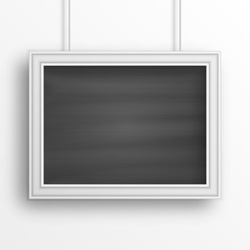Chalkboard background with white frame isolated on the white wall. Vector illustration