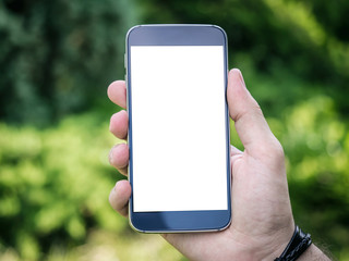 Man's hand holding mobile smartphone with white blank screen