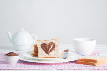 Sunday breakfast. Croissants with tea and peanut butter.