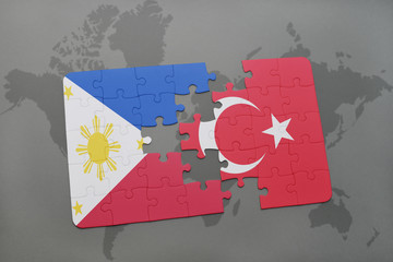puzzle with the national flag of philippines and turkey on a world map background.