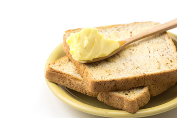 Butter and breads on white background 