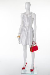 Festive silver dress on a white mannequin.
