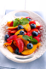 Fruit and berry salad on plate