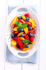 Fruit and berry salad on plate