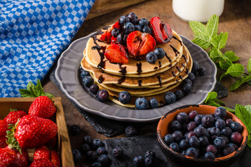 American pancakes with berries and chocolate