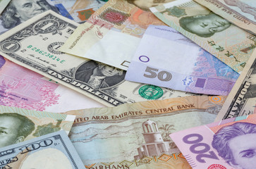Fototapeta na wymiar heap of several currencies banknotes