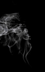 Abstract smoke moves on a black background