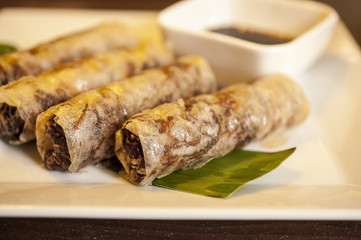 Fried Spring Rolls on the white plate and Soya souse