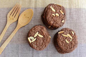 Chocolate chip cookies with smiley wooden spoon and fork.