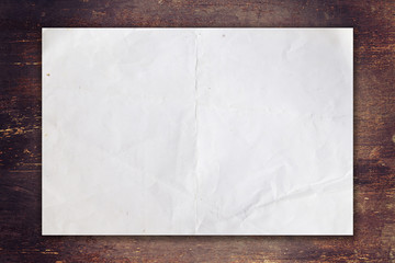 old paper on wood background with space