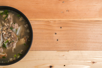 Pork Spare Ribs Rice Noodles Soup on wood background
